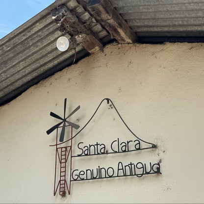Sign for Santa Clara Genuino Antigua, home of ATLAS COFFEE, showcasing Guatemala Coffee Beans heritage.
