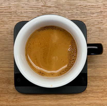 ETHIOPIA TWIN BOX coffee in a white cup on a scale, showcasing rich and aromatic brew.