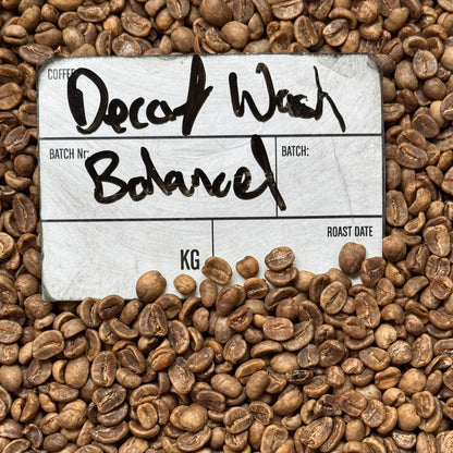 DECAF BALANCED coffee label on roasted beans, highlighting the balanced flavor profile of the decaf batch.