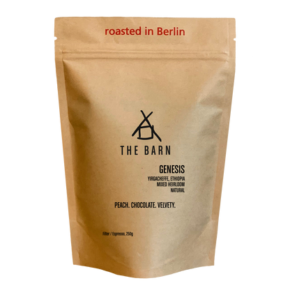 Kraft paper coffee bag with 'The Barn' branding and coffee description 'Gensis' on a white background