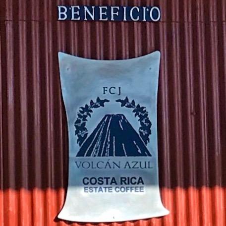 Sign for VOLCAN AZUL GESHA HONEY at the Volcán Azul coffee estate in Costa Rica.